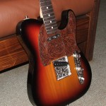 custom Telecaster with hand-engraved parts, hand-tooled leather pickguard